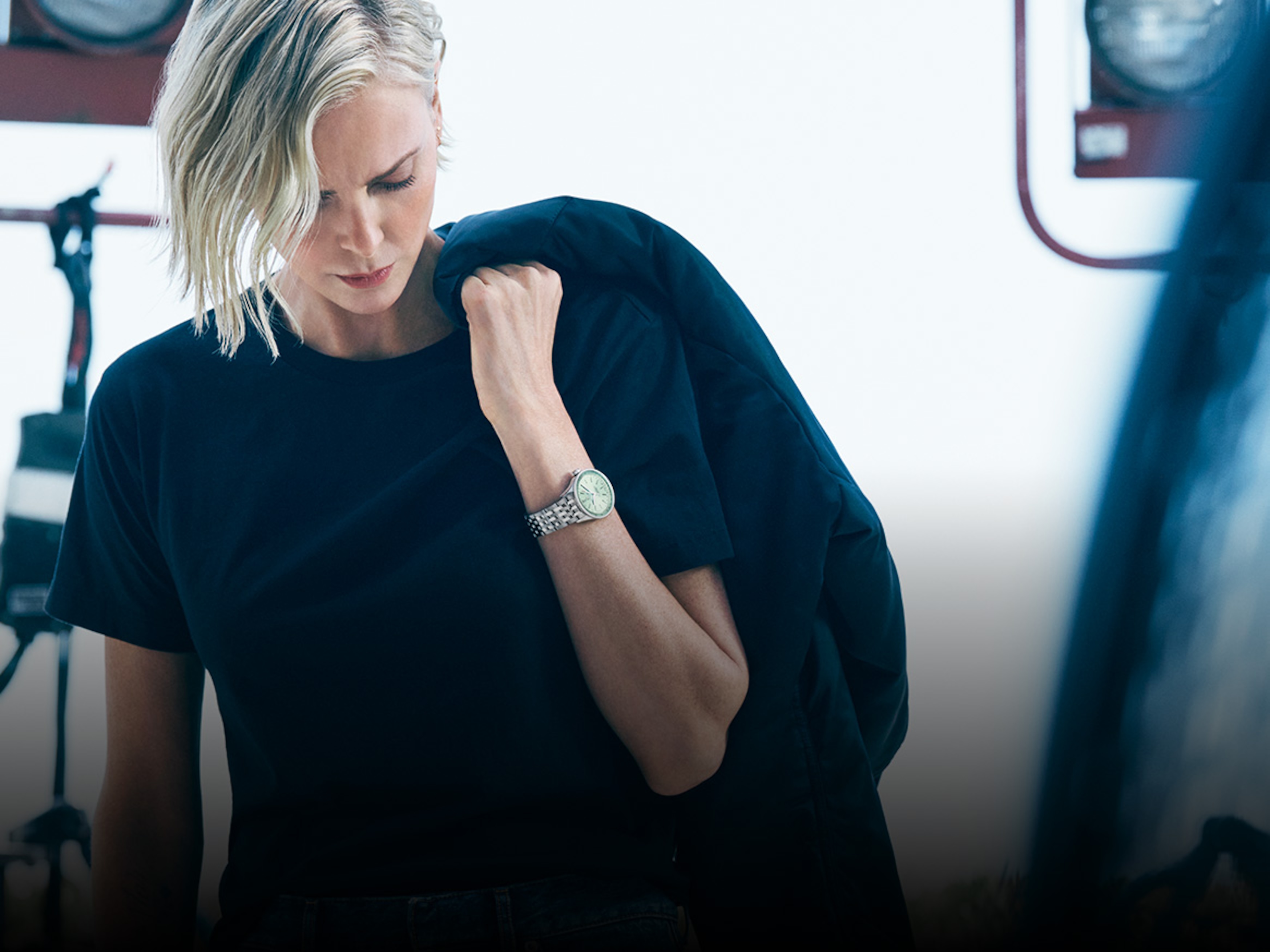 Actress Charlize Theron wears a Breilting watch on her wrist.