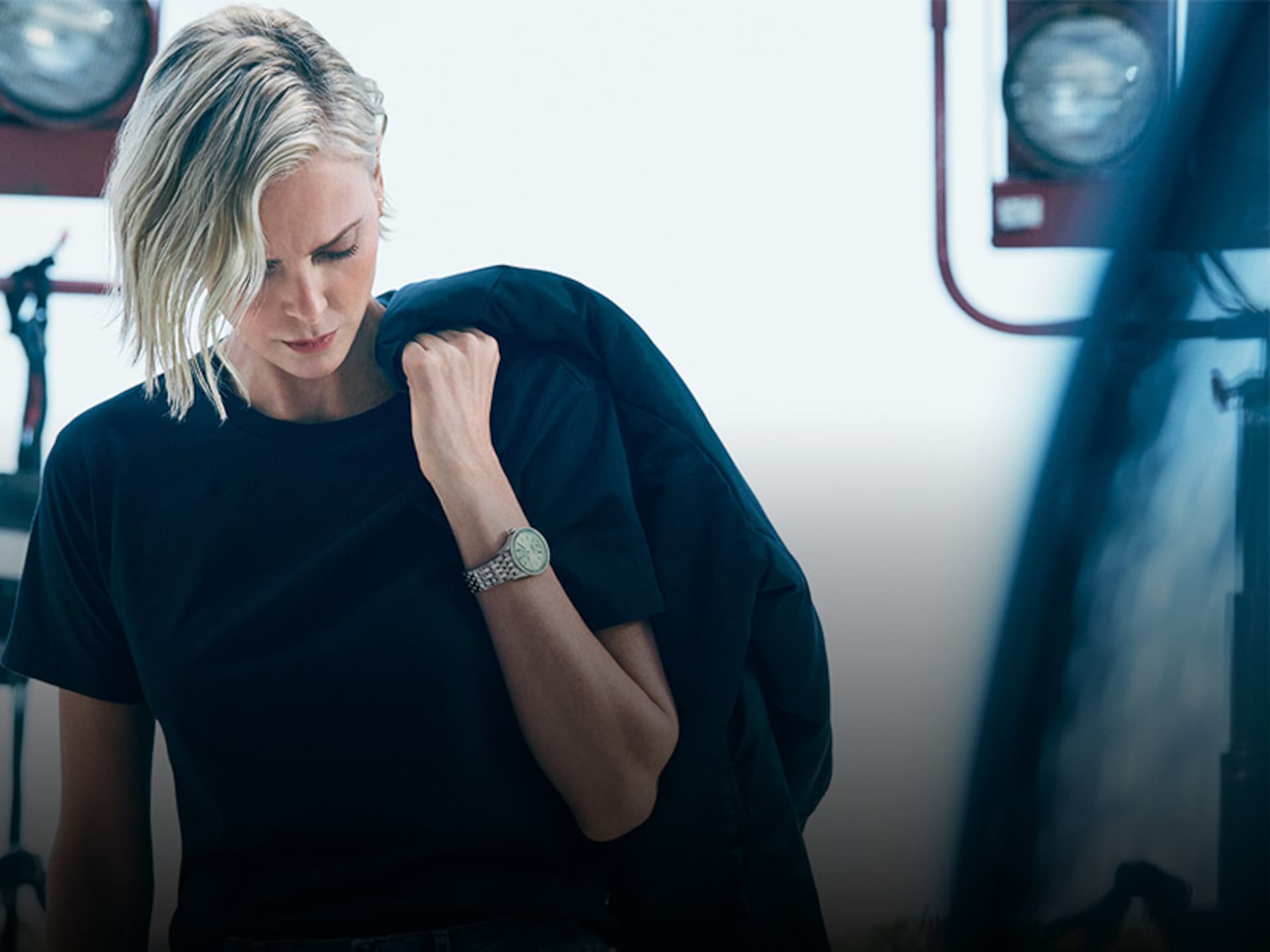 Actress Charlize Theron wears a Breilting watch on her wrist.